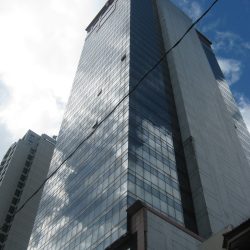View of Atlanta Centre when one look up while standing on the sidewalk on its side opposite to Beverly Condominium.