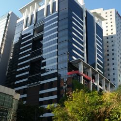 The Bench Tower is a high-rise building with a facade made mostly of blue glasses.