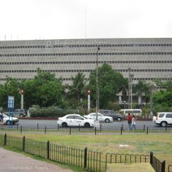 View of a Banko Sentral ng Pilipinas (Central Bank of the Philippines) building as seen from ASEAN Garden (foreground). The road between the central bank and the ASEAN Garden is Roxas Boulevard.
