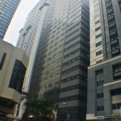 Robinsons Cyberscape Alpha has a blocky structure with a primarily black concrete facade and glasses. This is the Garnet Road frontage of Cyberscape Alpha as seen from Ruby Road.