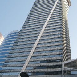 LKG Tower is a skyscraper with a unique diagonal support beam. Photo was taken while standing on the sidewalk on the opposite side of Ayala Avenue.