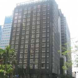 One Neo has a cuboid structure and exterior of black marble tiles and dark glass windows. This is One Neo, seen from the corner of Rizal Drive and 26th St.