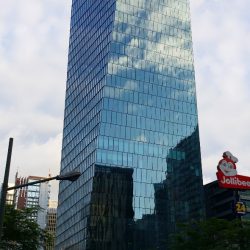 The Curve is a skyscraper with a facade covered chiefly with glass. It looks like a rectangular prism that was twisted slightly. This picture was taken from the opposite side of 32nd St., somewhere between Rizal Drive and 2nd Ave.