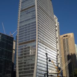 The Finance Center is an oval-shaped skyscraper with a facade of several glass panels on all sides.