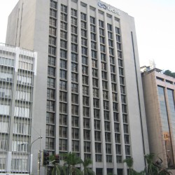 UCPB Corporate Offices is a blocky building with a facade of gray concrete. This picture was taken from Paseo De Roxas corner Makati Avenue, on the sidewalk adjacent to Zuellig Building.